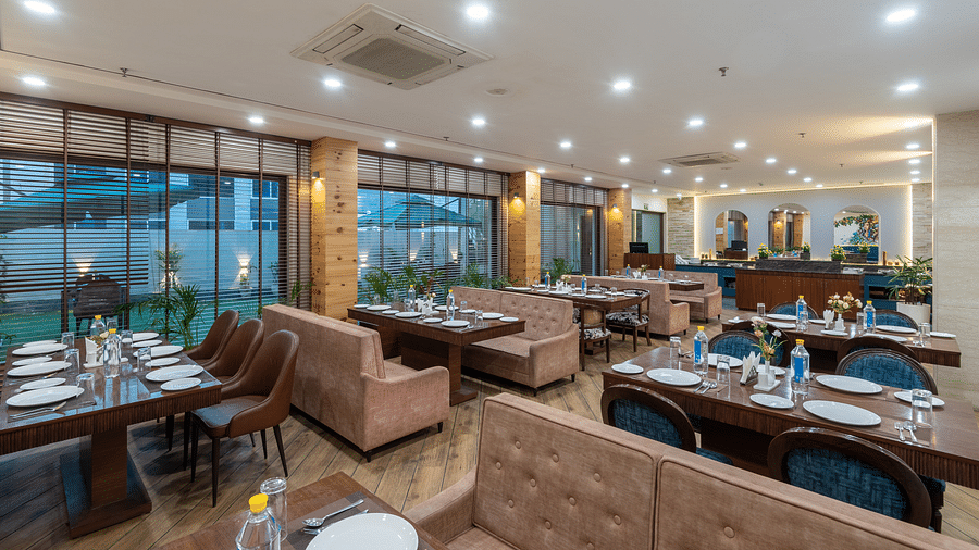 Dining area of a restaurant featuring air-conditioning and illuminating lights at DLS The Classio